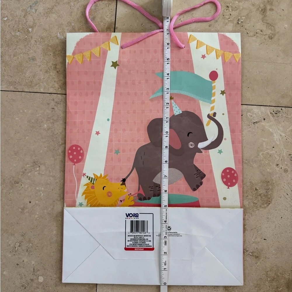 pink baby shower gift bag with circus scene